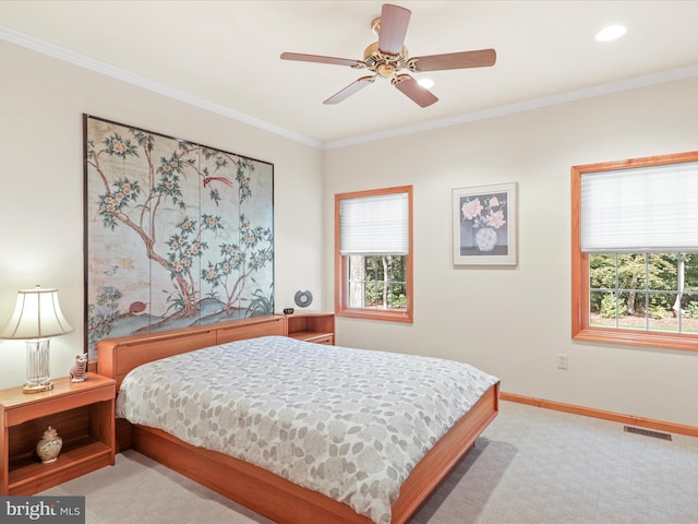 bedroom featuring light carpet, multiple windows, crown molding, and ceiling fan