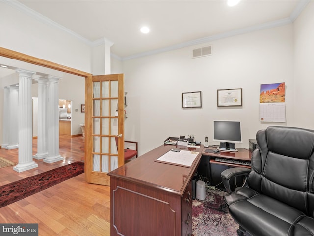 office space with french doors, crown molding, light wood-type flooring, and decorative columns