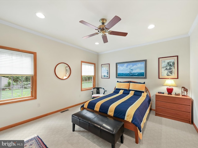 bedroom featuring light colored carpet, ceiling fan, multiple windows, and crown molding