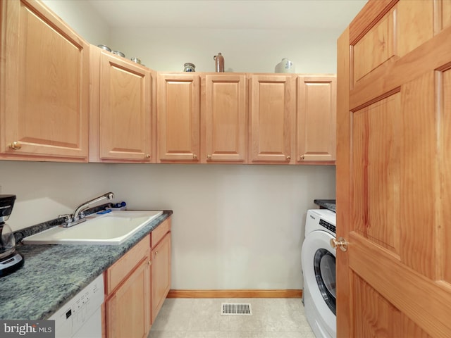 laundry room with cabinets, washer / dryer, light tile floors, and sink