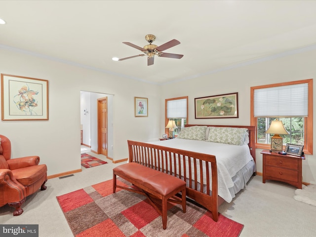 bedroom with light carpet, ceiling fan, and ornamental molding