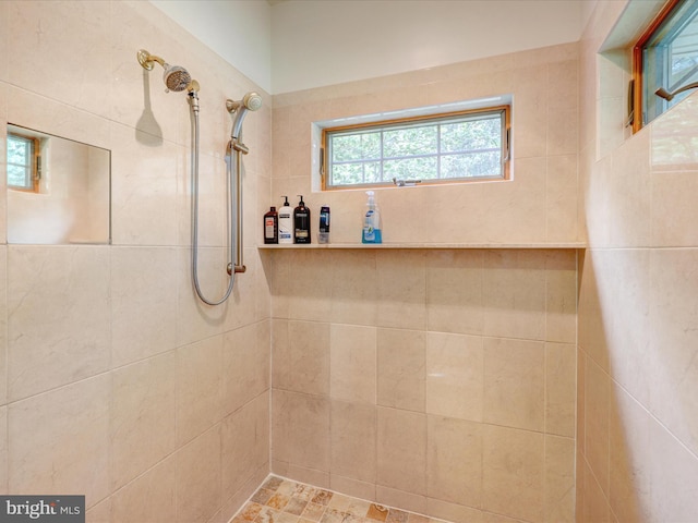 bathroom with a tile shower