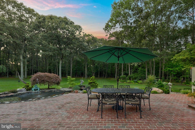 patio terrace at dusk with a lawn