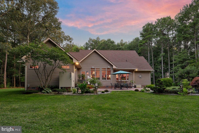 exterior space featuring a lawn and a patio