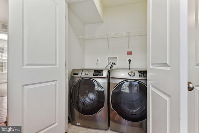 washroom featuring hookup for a washing machine, hookup for an electric dryer, and washing machine and dryer