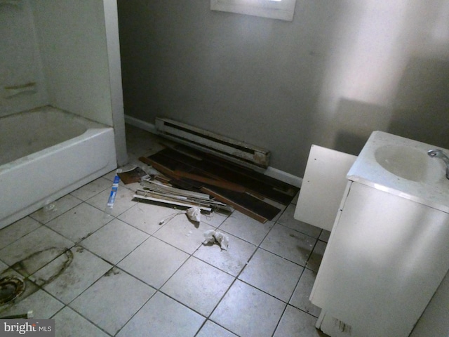 bathroom with tile floors, shower / washtub combination, vanity, and a baseboard radiator