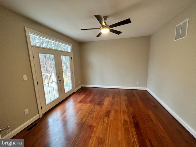 interior space with visible vents, baseboards, dark wood finished floors, and french doors