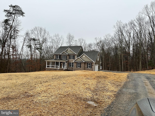 view of front of home with a sunroom