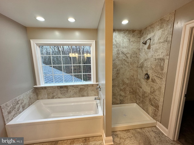 full bath featuring recessed lighting, tiled shower, and a bath