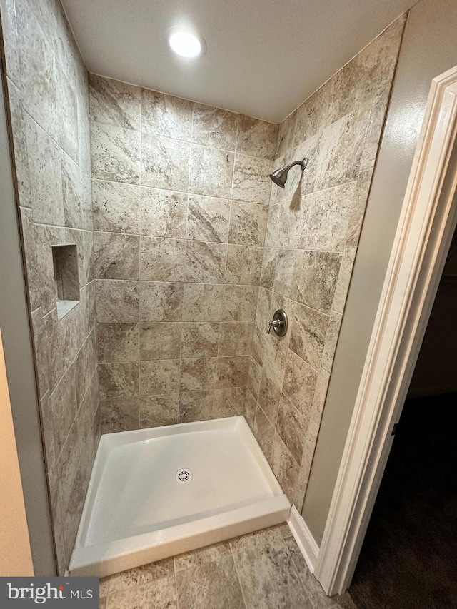 full bathroom featuring a stall shower