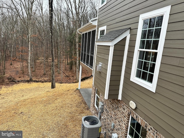 view of side of property featuring central AC unit