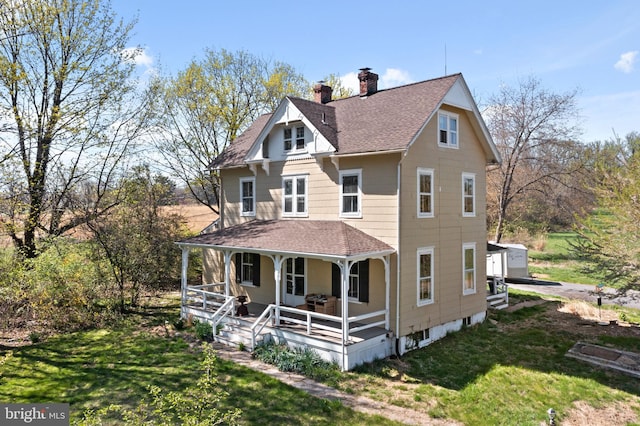 exterior space with a front lawn and covered porch