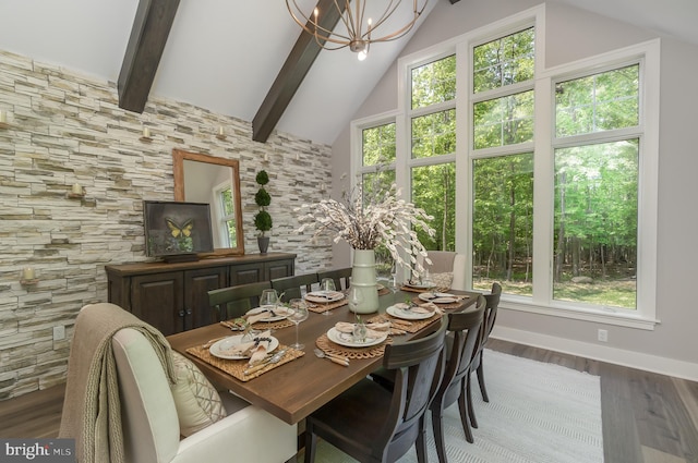 dining area featuring beam ceiling, a chandelier, dark hardwood / wood-style floors, and high vaulted ceiling