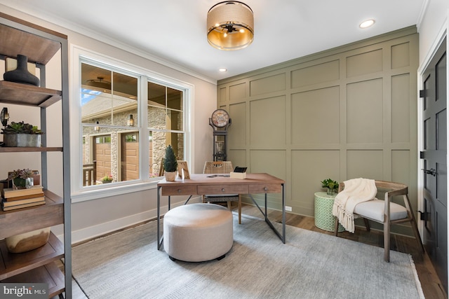 office area with ornamental molding and hardwood / wood-style flooring