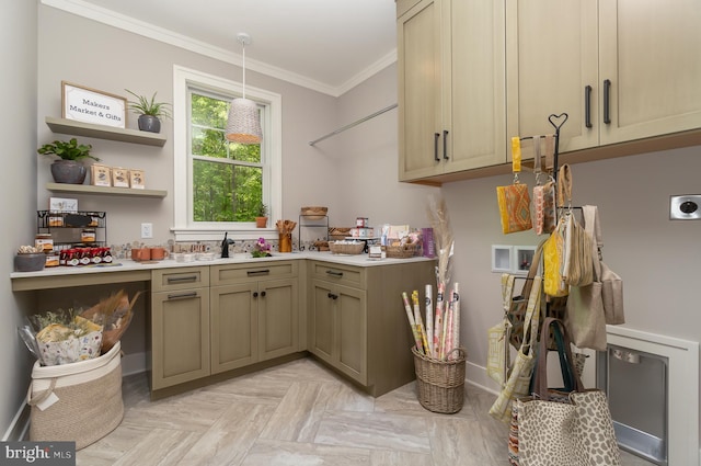 kitchen with light parquet floors, crown molding, and pendant lighting