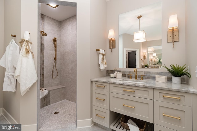 bathroom featuring tile flooring, oversized vanity, and tiled shower