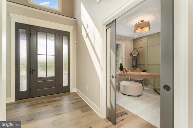 foyer with light wood-type flooring