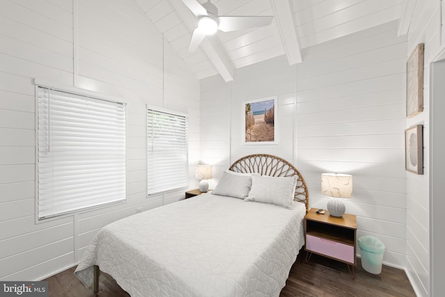 bedroom featuring ceiling fan, wood walls, lofted ceiling with beams, and dark hardwood / wood-style flooring