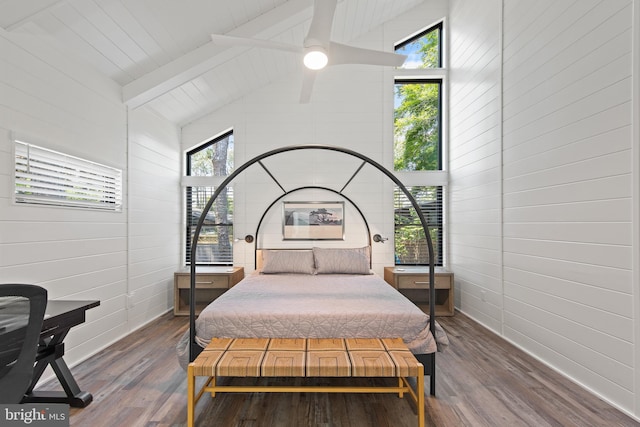 bedroom with beamed ceiling, ceiling fan, dark wood-type flooring, and high vaulted ceiling