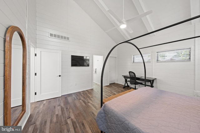 bedroom featuring beamed ceiling, dark wood-type flooring, and high vaulted ceiling