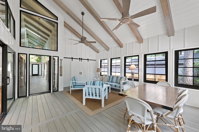 interior space featuring ceiling fan and vaulted ceiling with beams