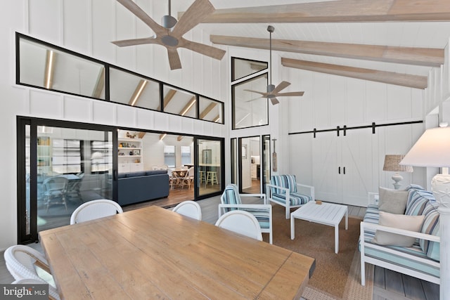 dining area with high vaulted ceiling, ceiling fan, and beamed ceiling