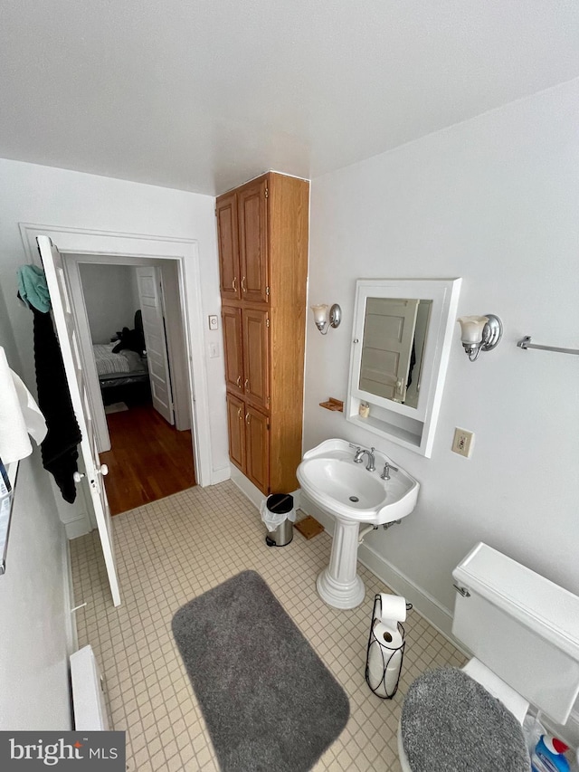 bathroom featuring tile floors