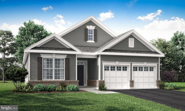 craftsman house featuring a front yard and a garage