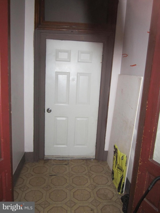 hallway featuring light tile flooring