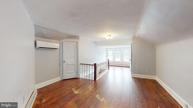 bonus room with lofted ceiling, a baseboard heating unit, a wall unit AC, and dark hardwood / wood-style flooring