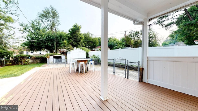 wooden deck featuring a shed