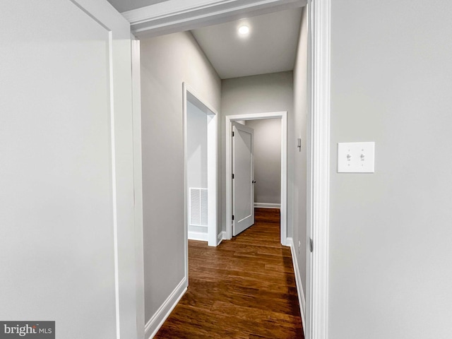 hallway featuring dark hardwood / wood-style floors