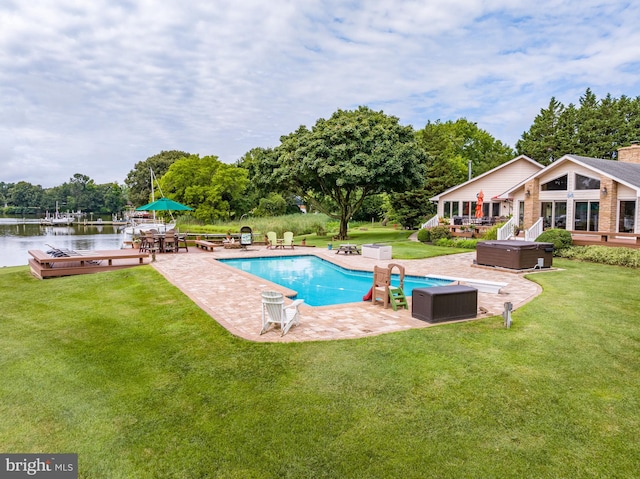 view of swimming pool with a lawn and a patio