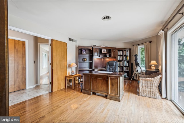 office space featuring light tile floors