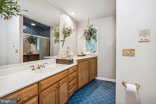 bathroom featuring tile floors and vanity with extensive cabinet space