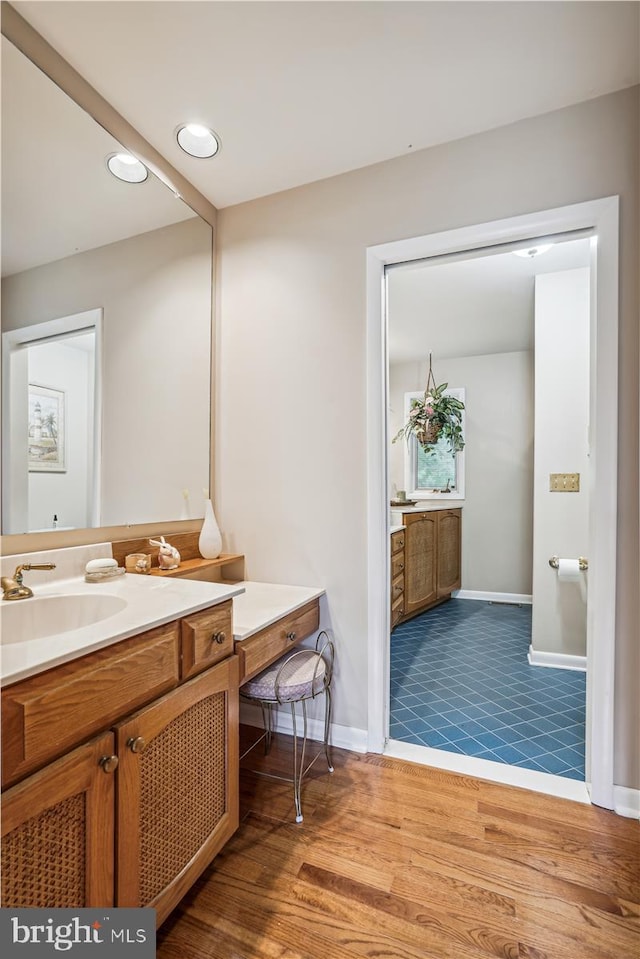 bathroom featuring vanity and tile floors