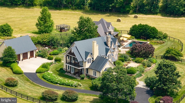 birds eye view of property featuring a rural view