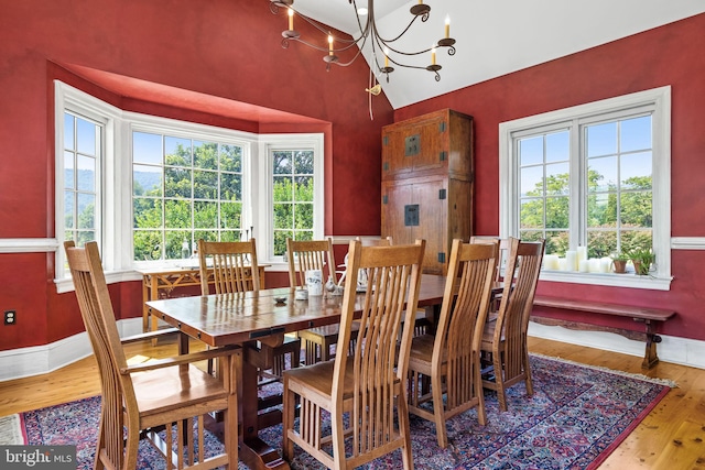 dining room featuring hardwood / wood-style flooring and an inviting chandelier