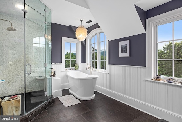 bathroom with tile patterned floors, a notable chandelier, and independent shower and bath