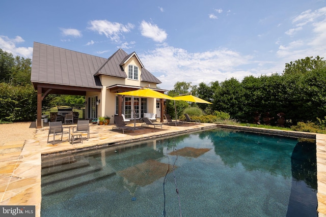 view of pool with a patio area