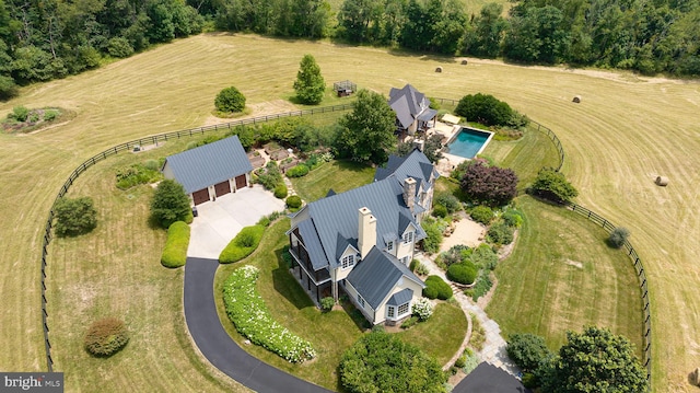 birds eye view of property featuring a rural view