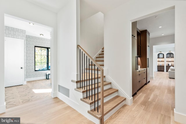 stairway with wood-type flooring