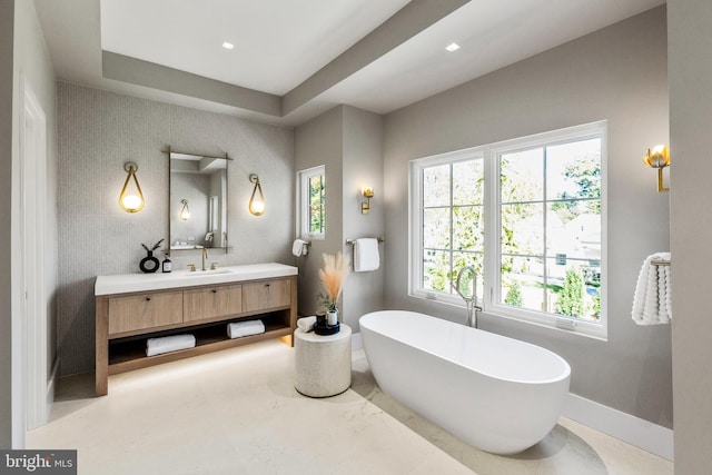 bathroom with vanity and a bathtub