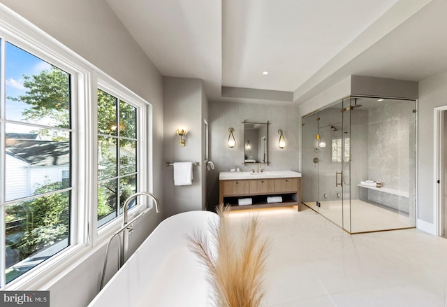 bathroom featuring vanity and separate shower and tub