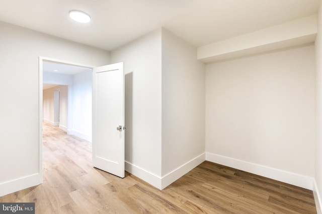 hall with light hardwood / wood-style floors