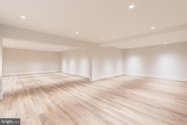 unfurnished room with light wood-type flooring