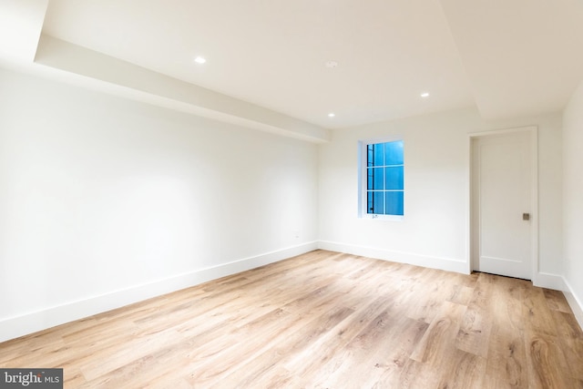 empty room with light hardwood / wood-style flooring