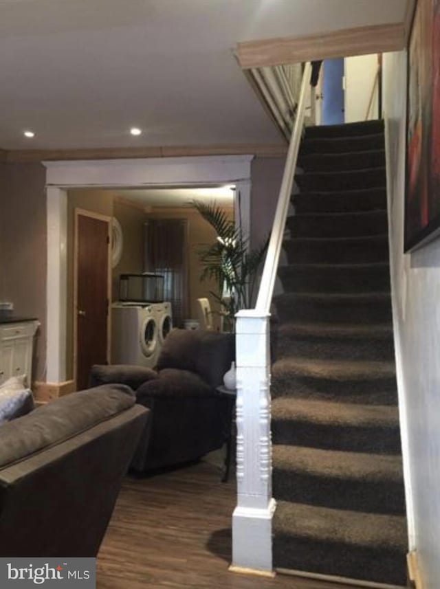 stairway with hardwood / wood-style floors