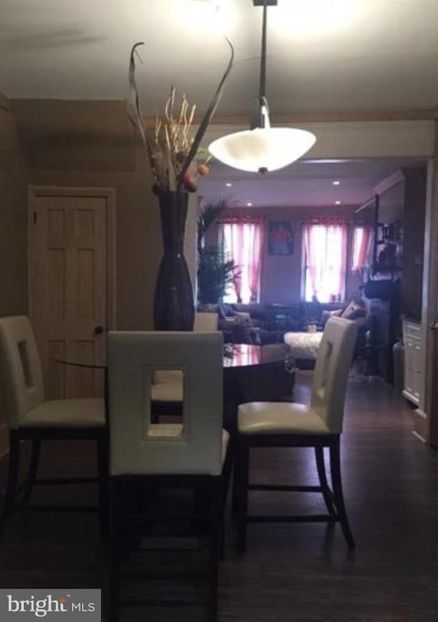 dining area featuring dark hardwood / wood-style flooring