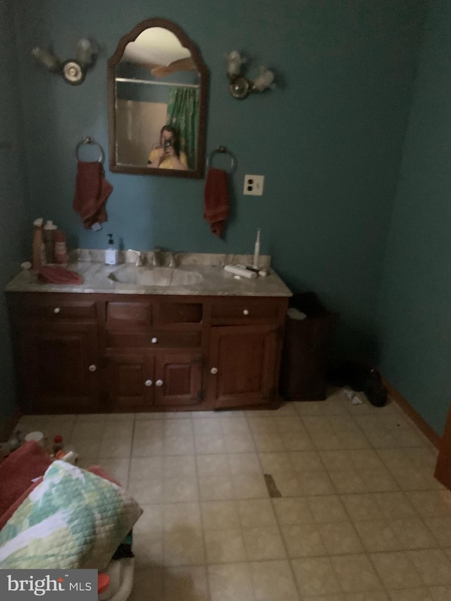 bathroom with large vanity and tile floors